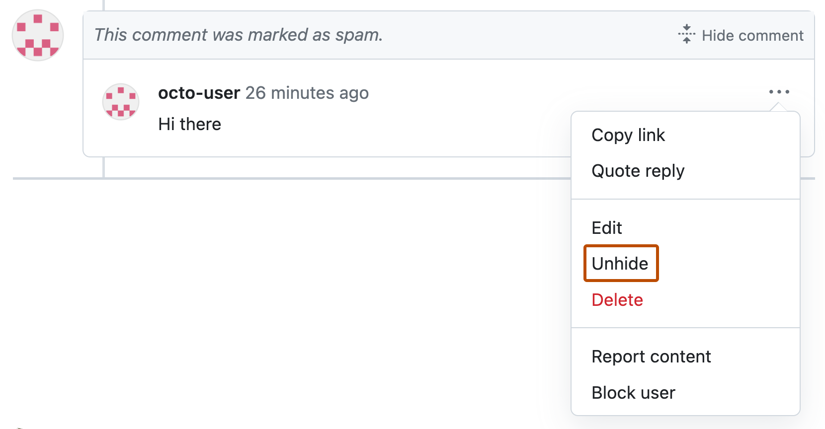 Screenshot of a pull request comment marked as spam. Below an icon of three horizontal dots, a dropdown menu is expanded, and "Unhide" is outlined in orange.
